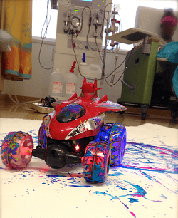 Child 4 wheeler with paint on it